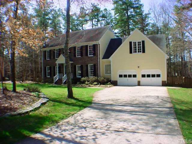 5613 North Hawthorne Way Raleigh, NC 27613 - Photo 1 of 1 a front view of a house with a yard and trees