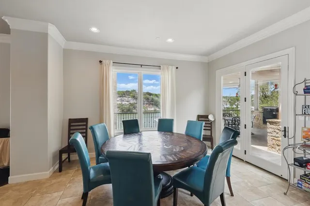 a view of a dining room with furniture window and outside view