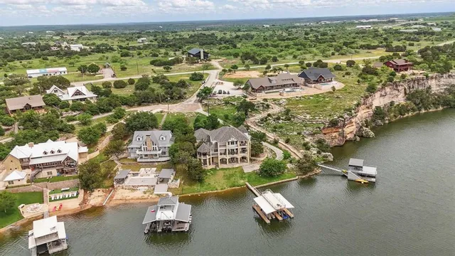 an aerial view of residential houses with outdoor space