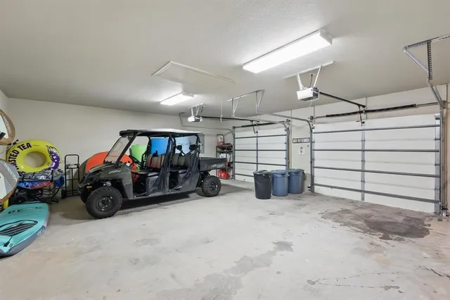 a front view of a house with yard and trees