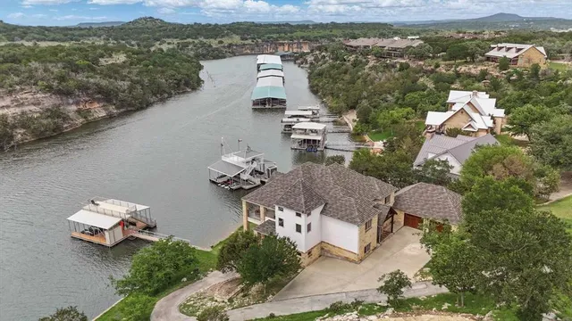 an aerial view of a house with a lake view