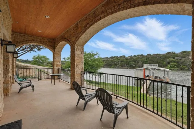 a view of a chairs and tables in the balcony