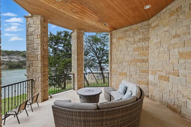 a living room with couch and a potted plant