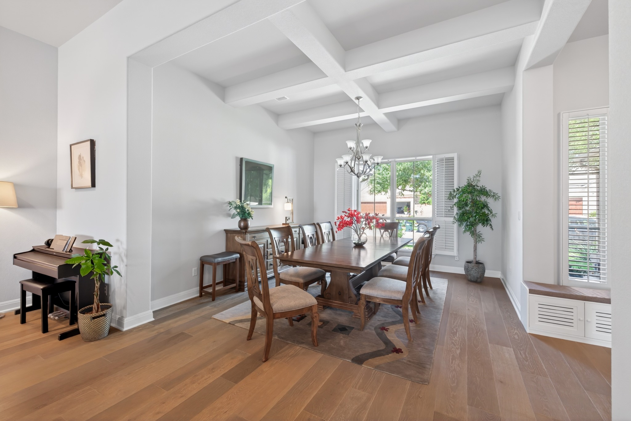4105 Haight Street Round Rock, TX 78681 - Photo 5 of 40 a dining room with furniture potted plants and wooden floor