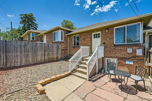 a view of house with outdoor seating space