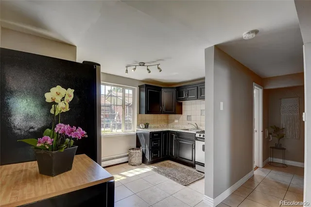 a kitchen with a sink cabinets and window