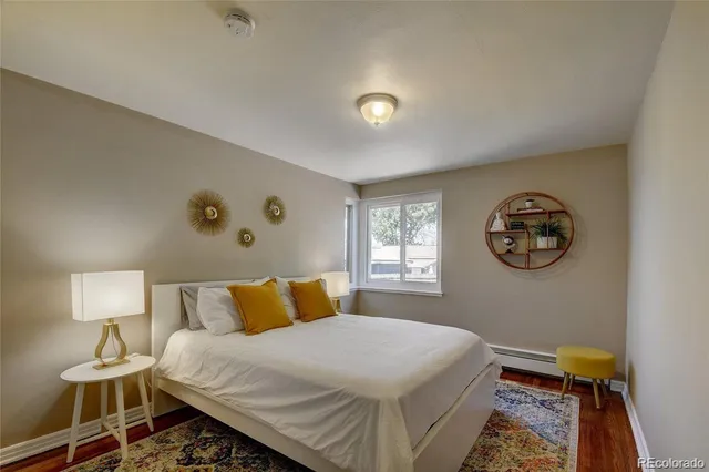 a bedroom with a bed and a lamp