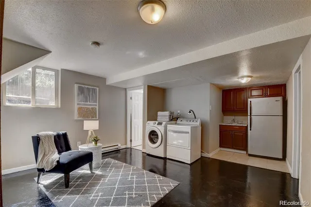 a white refrigerator freezer sitting in a kitchen
