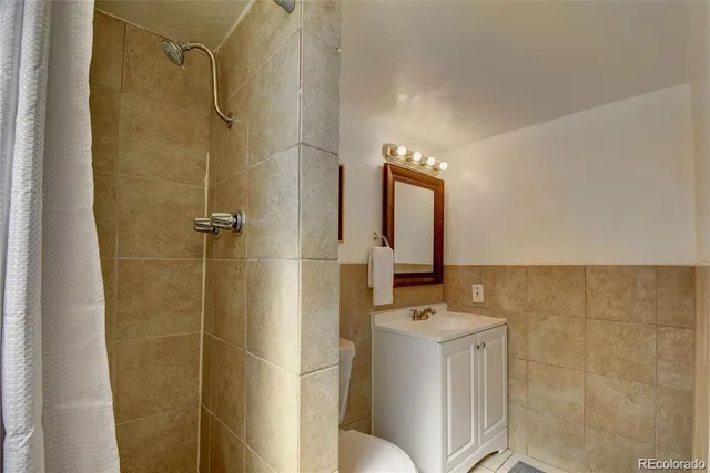 a work room with furniture and a wooden floor