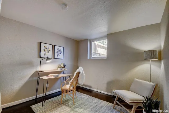 an aerial view of a house with garden space and street view