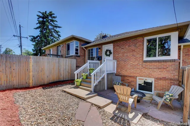 a view of a house with wooden stairs