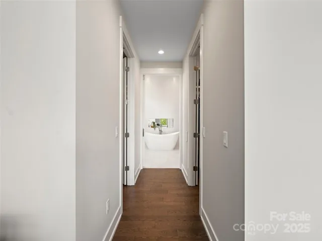 a view of a hallway with white walls