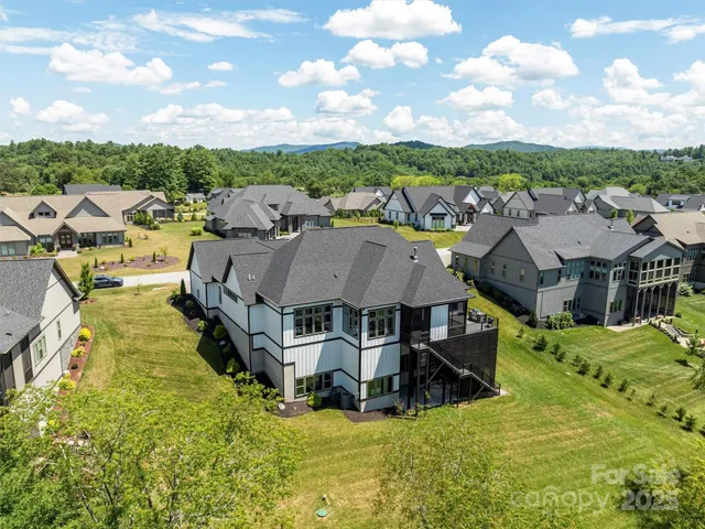 a view of a town with mountains in the background