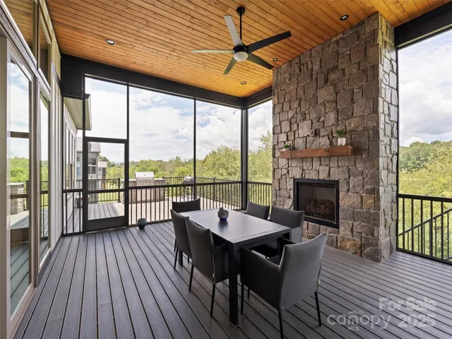 a dining room with furniture window and wooden floor