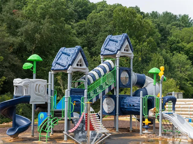 an aerial view of houses with yard