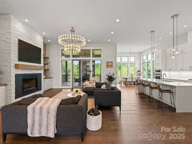 a living room with fireplace furniture and a flat screen tv