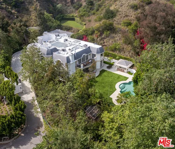 an aerial view of a house with a garden
