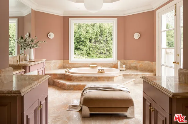 a bathroom with a shower and a glass door
