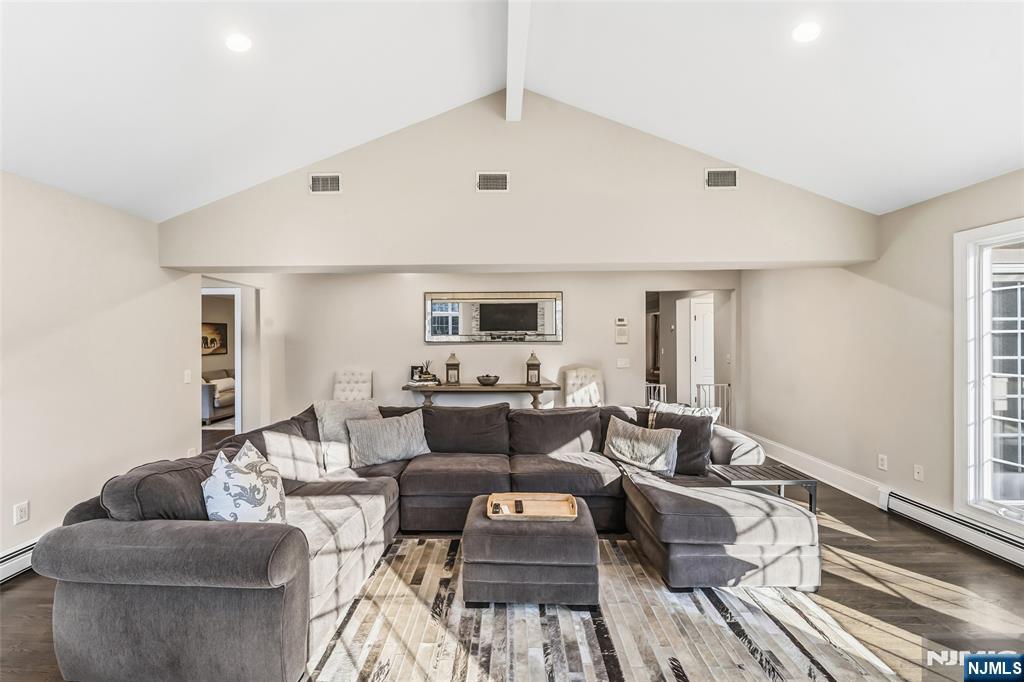 27 Pine Hill Road Old Tappan, NJ 07675 - Photo 19 of 50 a living room with furniture and a flat screen tv