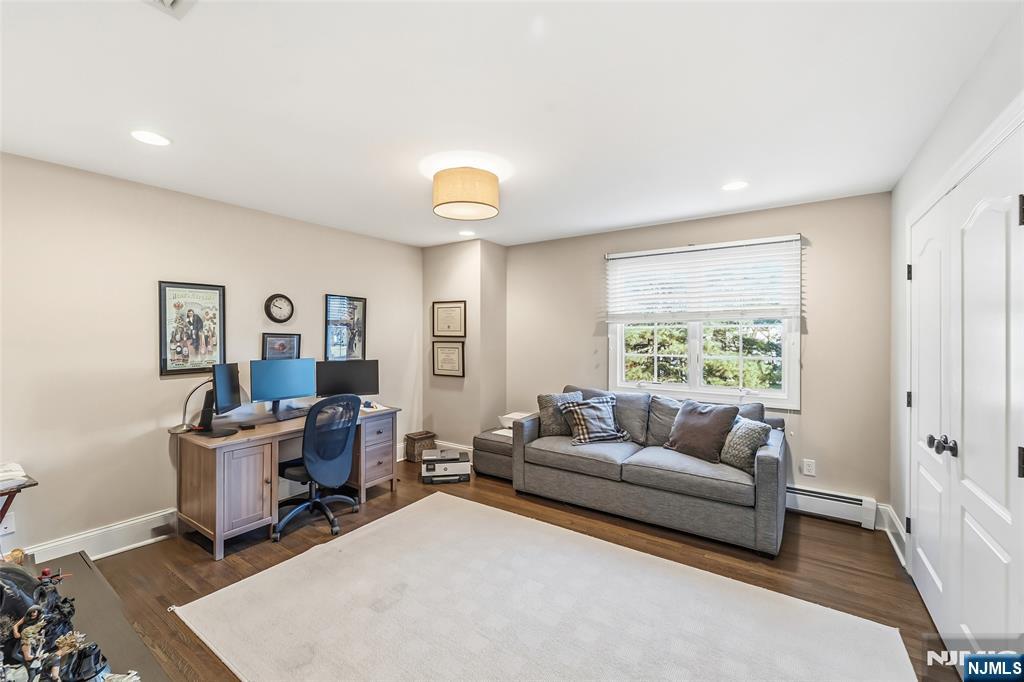 27 Pine Hill Road Old Tappan, NJ 07675 - Photo 23 of 50 a living room with furniture and a large window