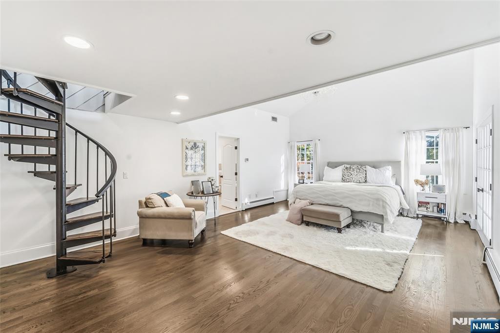 27 Pine Hill Road Old Tappan, NJ 07675 - Photo 25 of 50 a bedroom with a bed and wooden floor