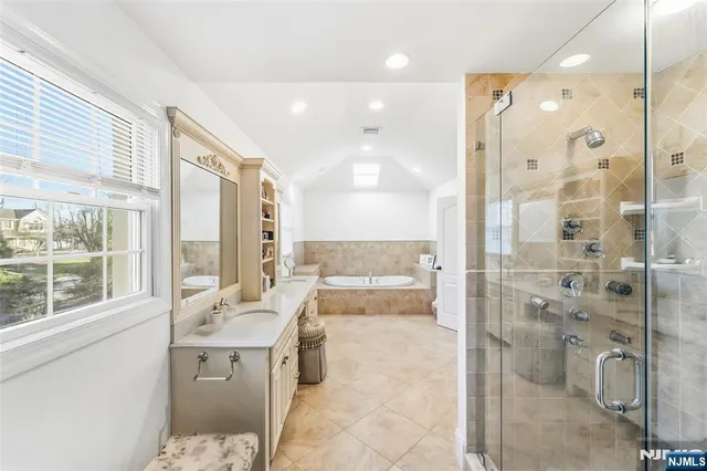 a bedroom with bed and a large window