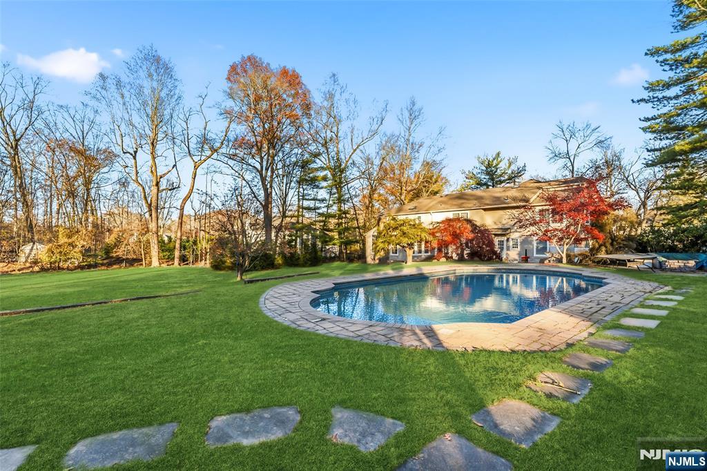 27 Pine Hill Road Old Tappan, NJ 07675 - Photo 47 of 50 a view of a swimming pool with a yard