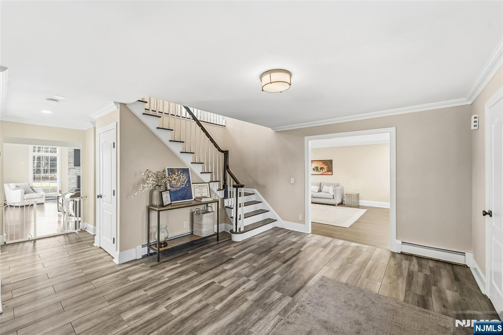 27 Pine Hill Road Old Tappan, NJ 07675 - Photo 5 of 50 a view of a livingroom with wooden floor and stairs
