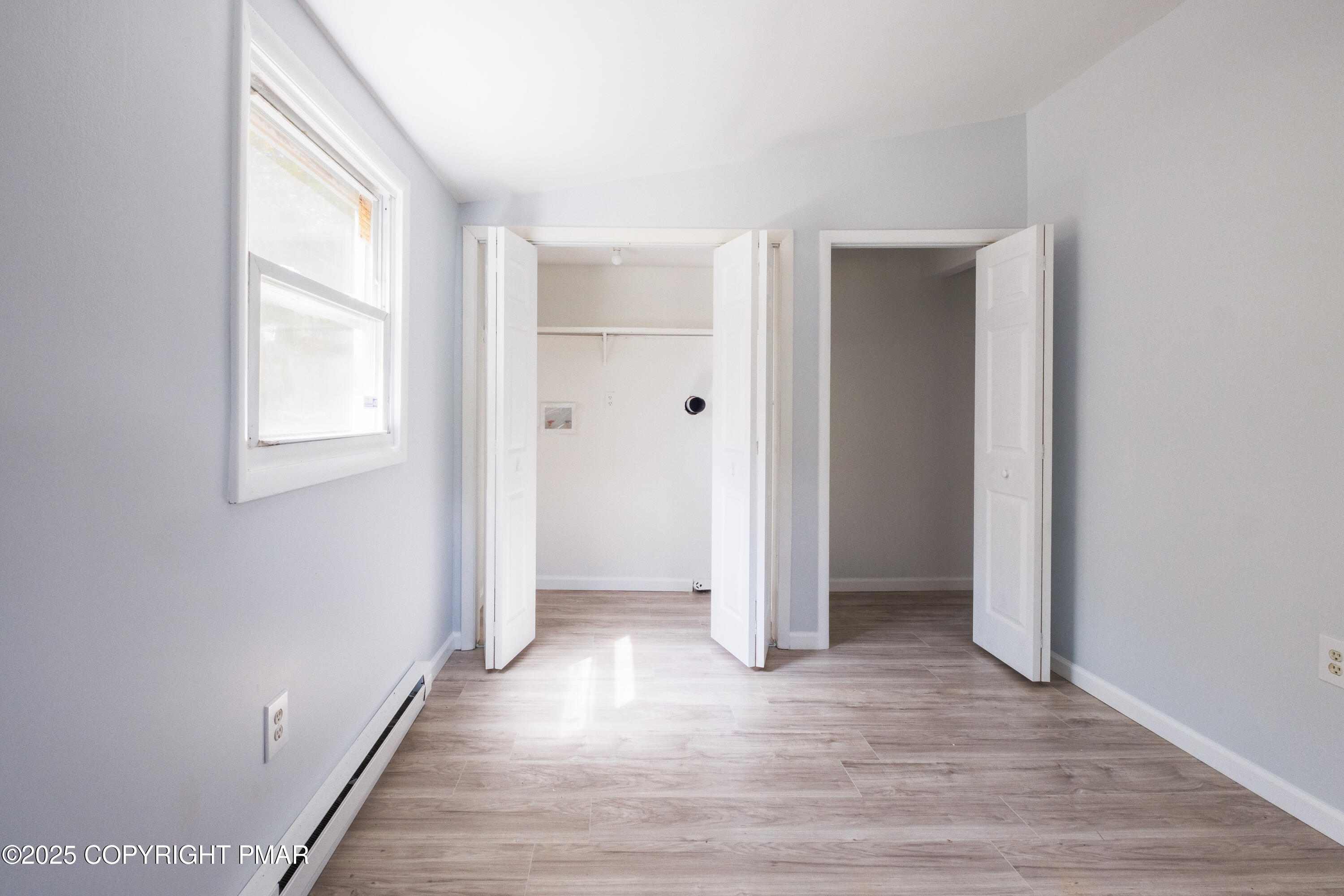 4774 Pine Ridge Drive West Bushkill, PA 18324 - Photo 27 of 36 a view of entryway with window and wooden floor