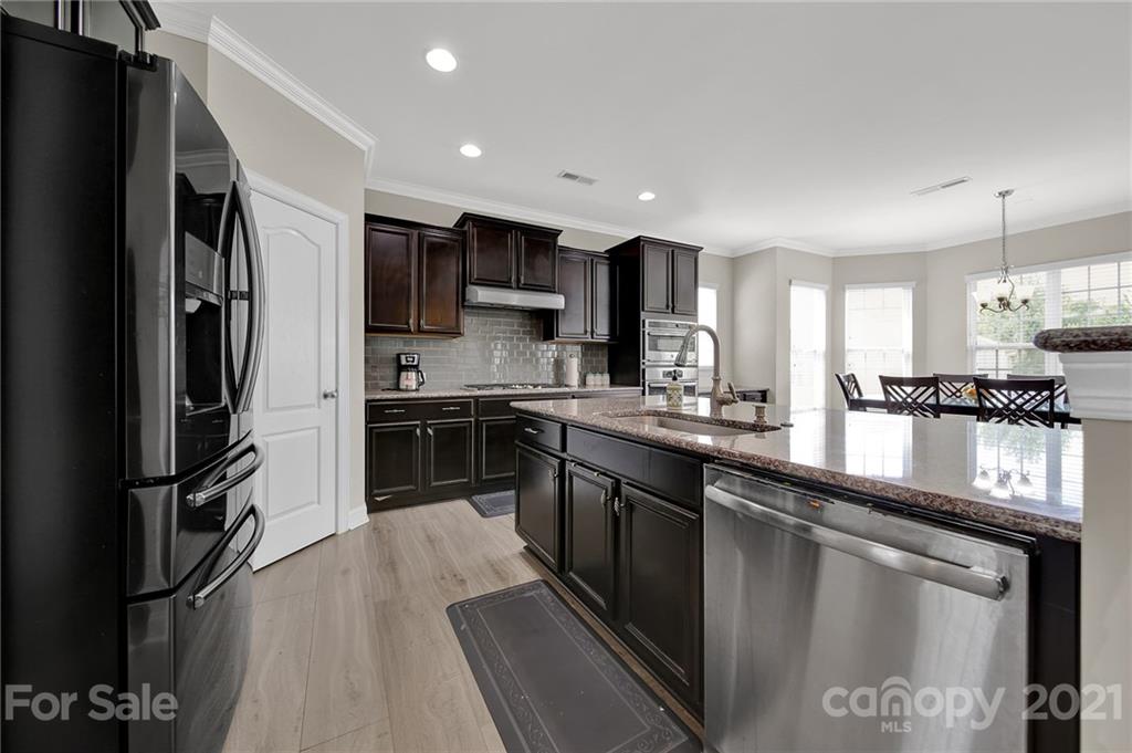 813 Bridge View Court Fort Mill, SC 29708 - Photo 11 of 42 a kitchen with stainless steel appliances granite countertop a refrigerator a stove and a sink