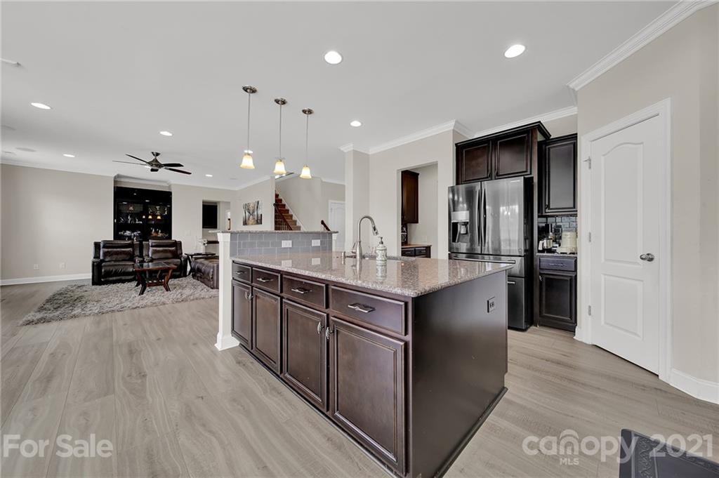 813 Bridge View Court Fort Mill, SC 29708 - Photo 13 of 42 a large kitchen with stainless steel appliances lots of counter space and wooden floor