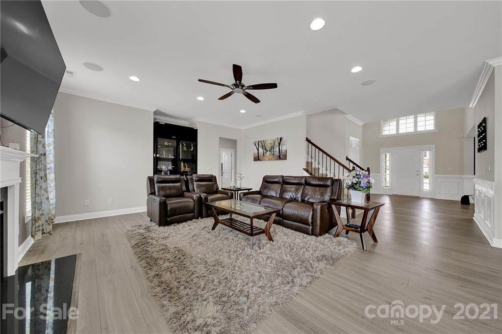 813 Bridge View Court Fort Mill, SC 29708 - Photo 17 of 42 a living room with furniture kitchen view and a wooden floor