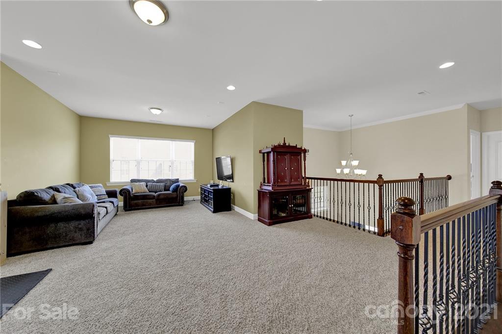 813 Bridge View Court Fort Mill, SC 29708 - Photo 24 of 42 a living room with furniture cabinets and a window