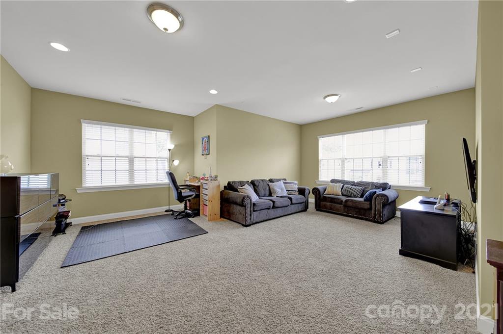 813 Bridge View Court Fort Mill, SC 29708 - Photo 25 of 42 a living room with furniture and a large window