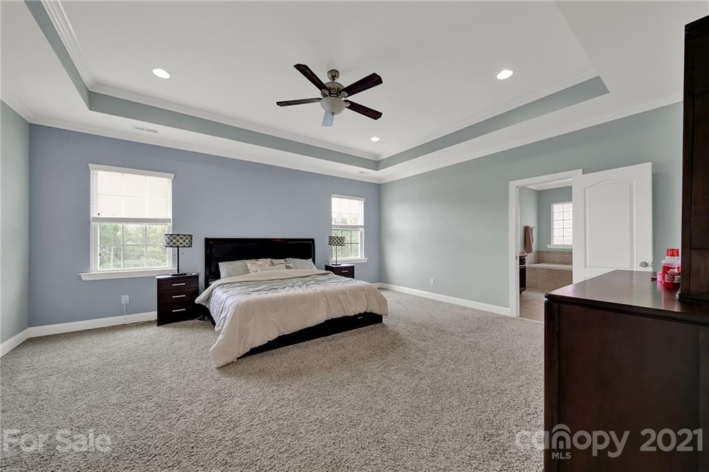 813 Bridge View Court Fort Mill, SC 29708 - Photo 30 of 42 a bedroom with a bed and a dresser