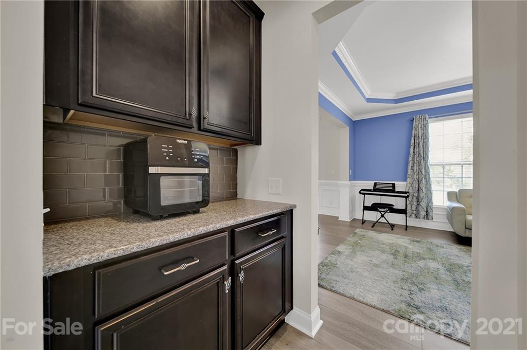 813 Bridge View Court Fort Mill, SC 29708 - Photo 10 of 42 a kitchen with granite countertop cabinets and window
