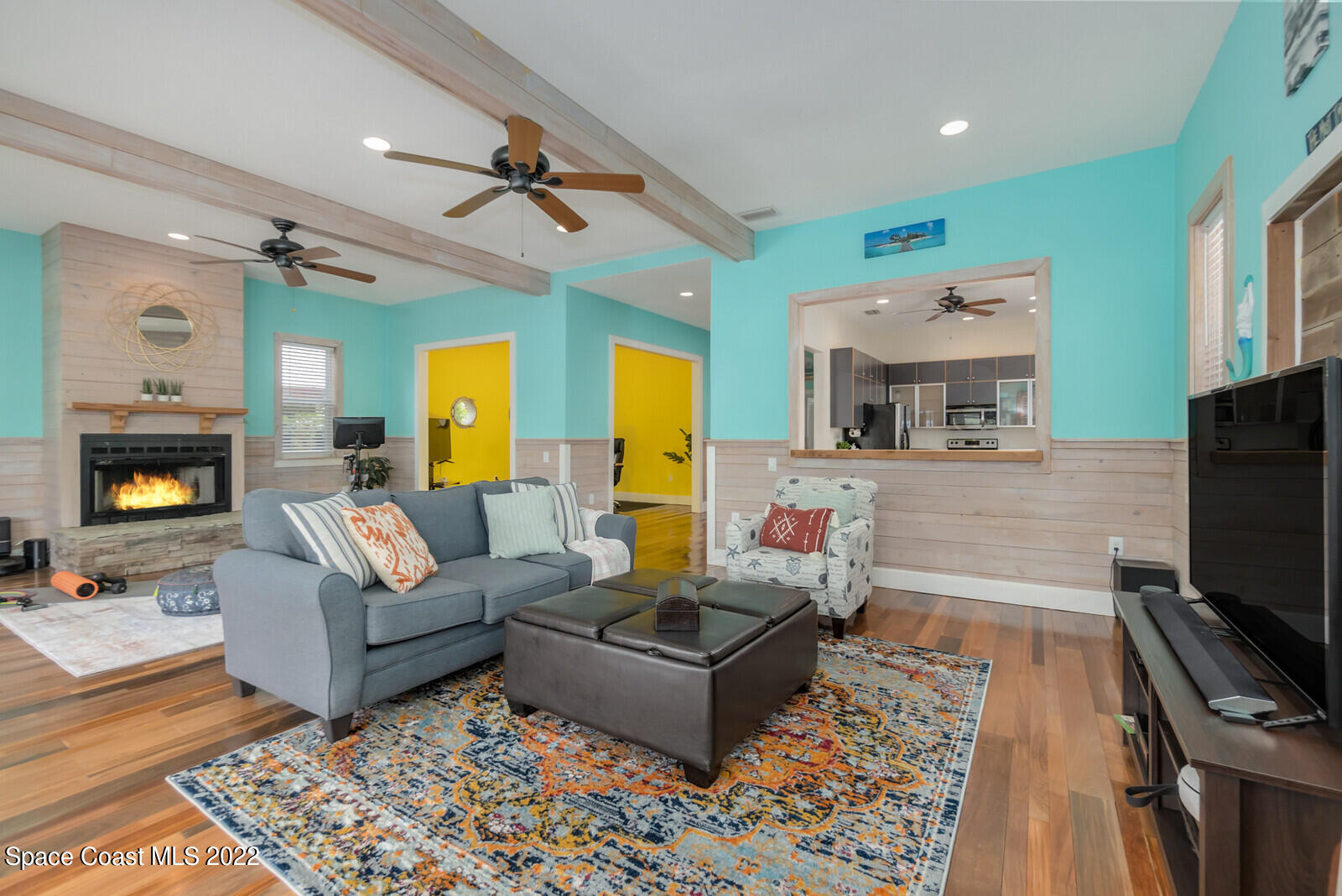 48 Vip Island Grant, FL 32949 - Photo 11 of 38 a living room with furniture and a flat screen tv