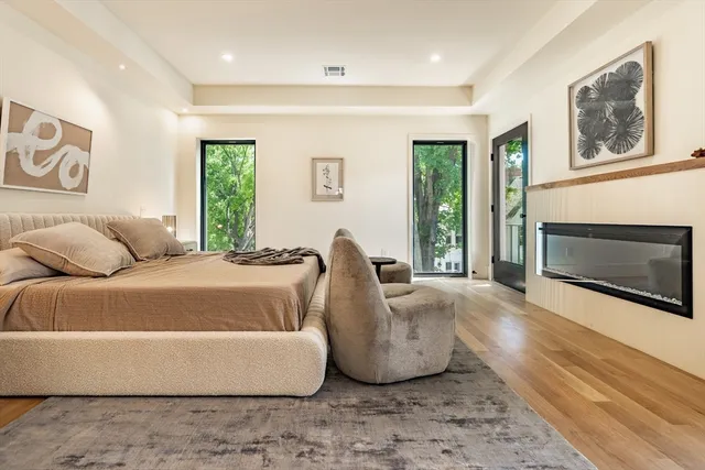 a spacious bedroom with a bed and a couch