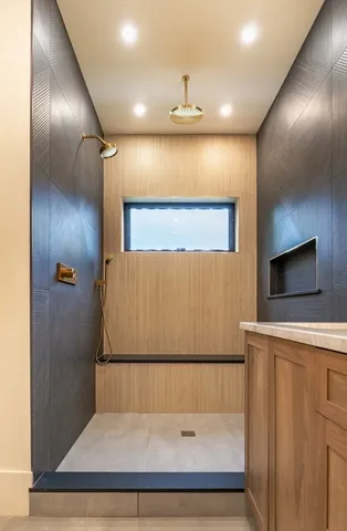 a bathroom with a bathtub and a shower