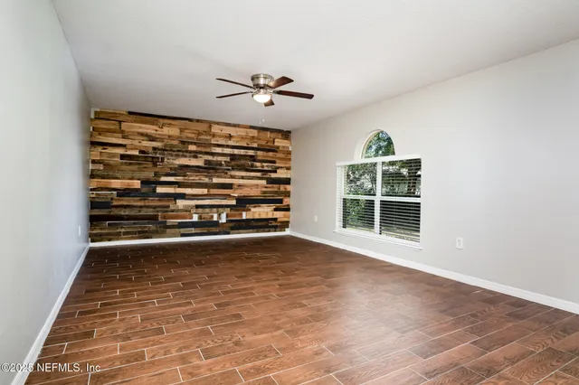 a view of empty room with windows