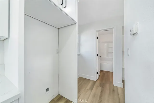 a kitchen with a sink stove and microwave