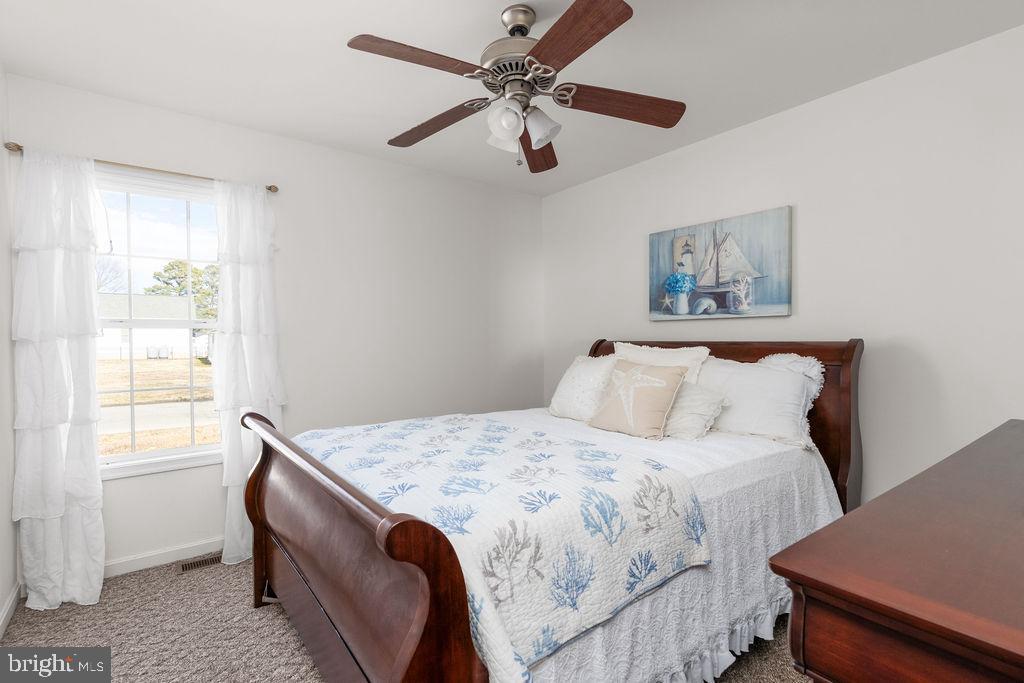 200 5th Street Colonial Beach, VA 22443 - Photo 21 of 45 Serene bedroom with natural light and charm.