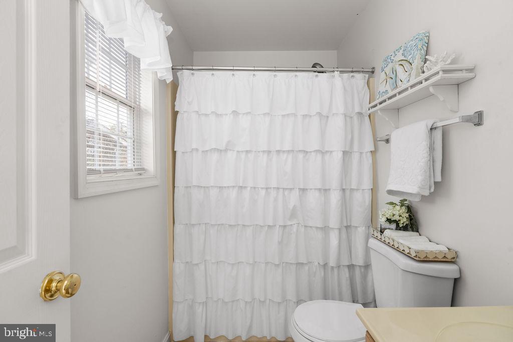 200 5th Street Colonial Beach, VA 22443 - Photo 26 of 45 Bright and airy bathroom with elegant touches.