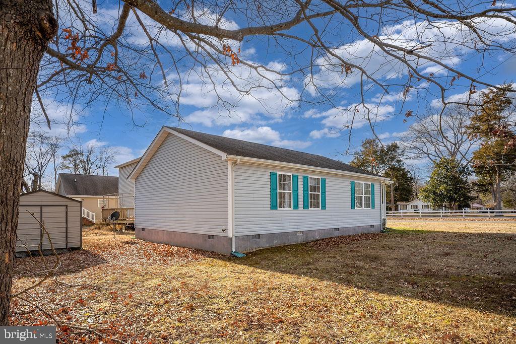 200 5th Street Colonial Beach, VA 22443 - Photo 4 of 45 Charming home with vibrant blue accents.