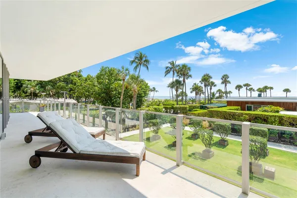 a view of a swimming pool with a patio and a garden