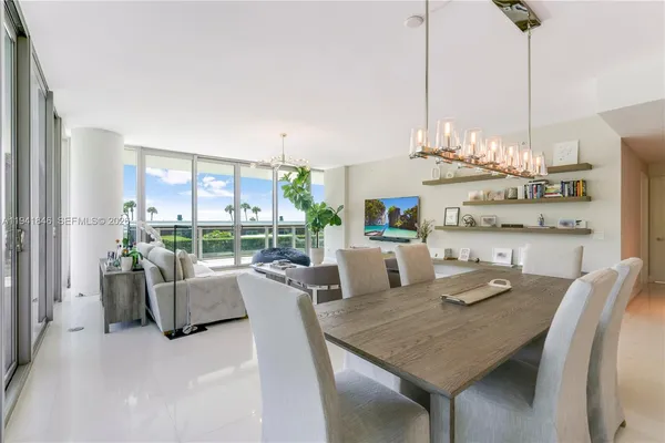 a view of a dining room with furniture window and outside view