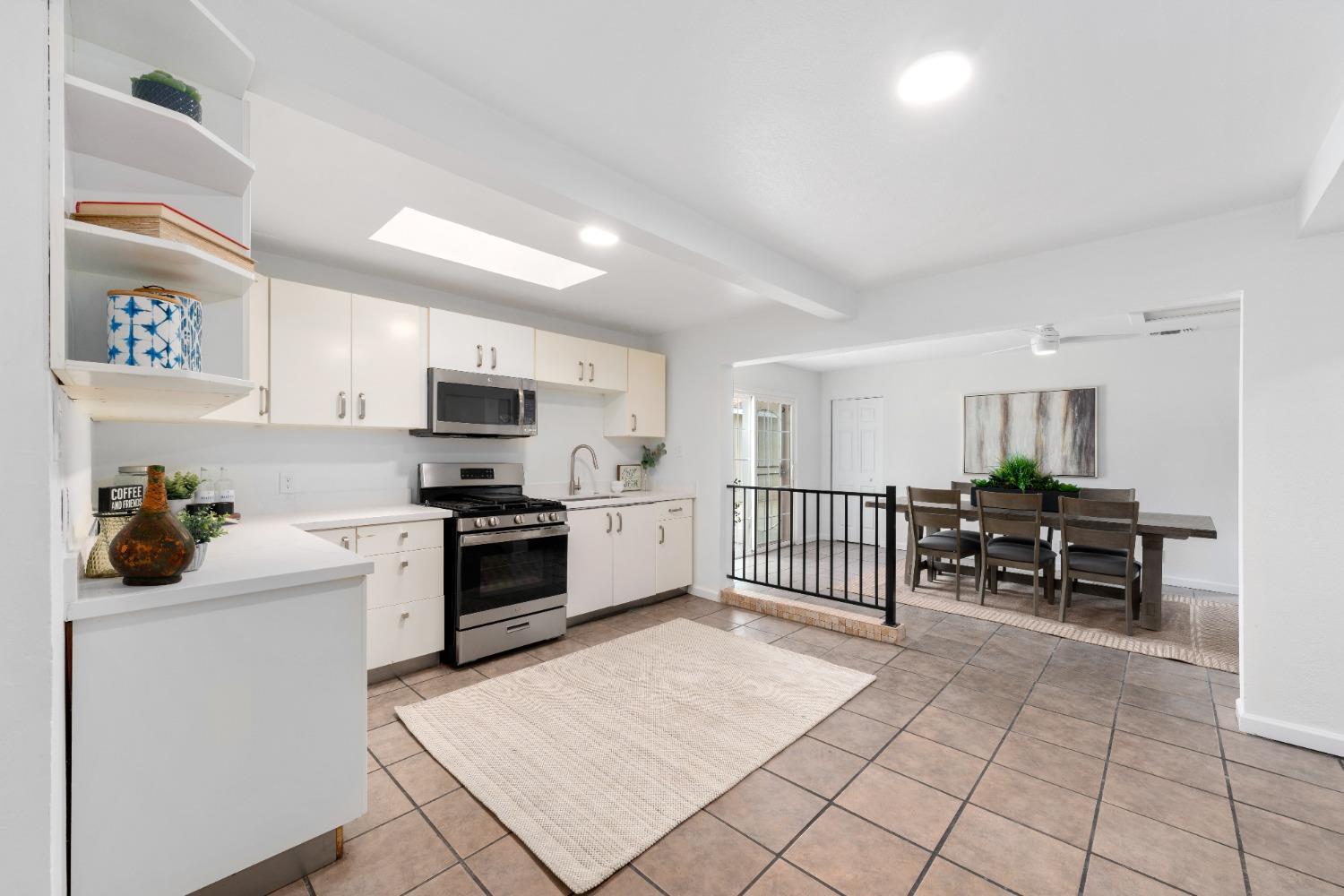 428 Q Q Rio Linda, CA 95673 - Photo 3 of 11 a kitchen with granite countertop a sink cabinets and stainless steel appliances