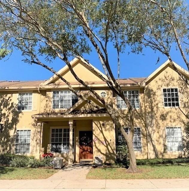 823 Grand Regency Point, Unit 102 Altamonte Springs, FL 32714 - Photo 1 of 12 a front view of a house with garden
