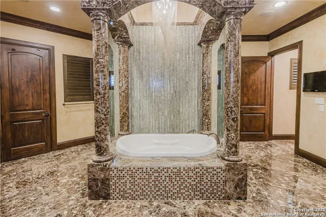 a bathroom with a double vanity sink and a bathtub