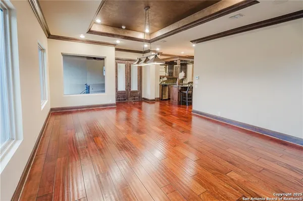 a bathroom with a granite countertop toilet sink and mirror